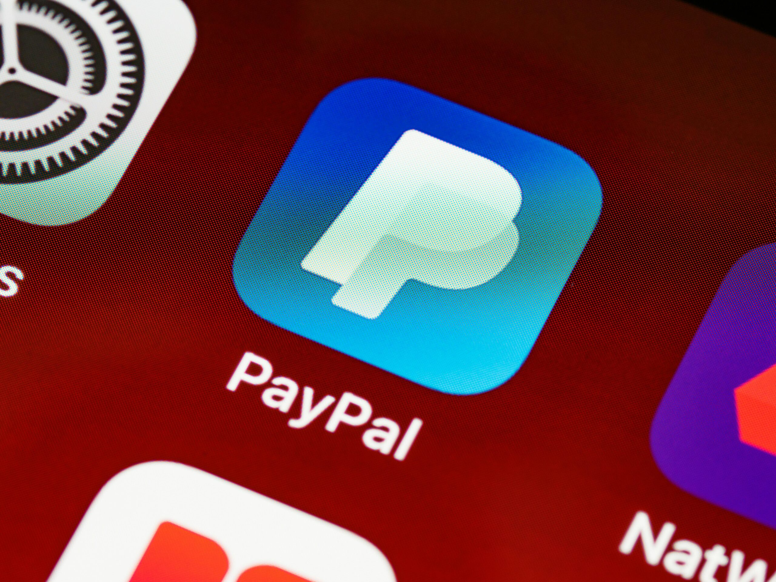 Detailed view of PayPal app icon on a smartphone screen highlighting mobile payment technology.